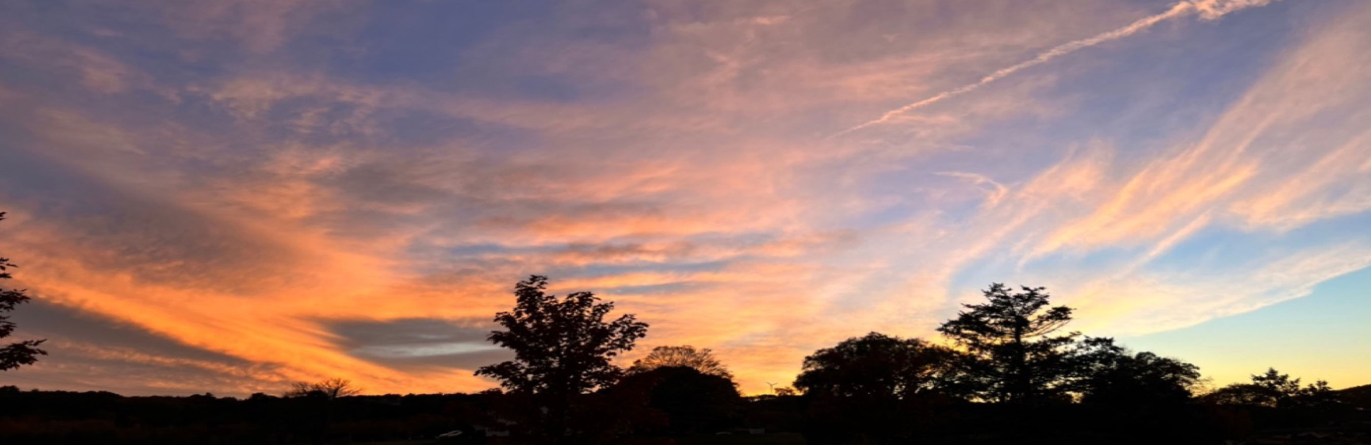 Header - Sunset Sky - Who We Are